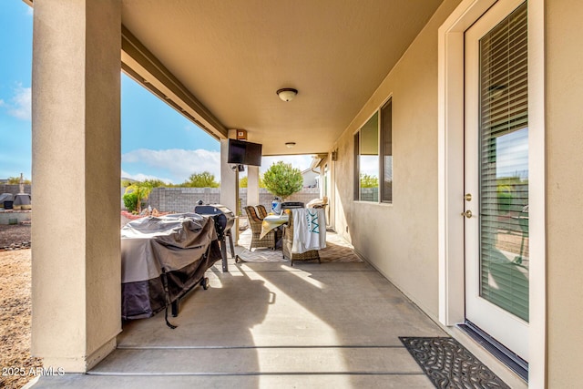 view of patio / terrace featuring fence