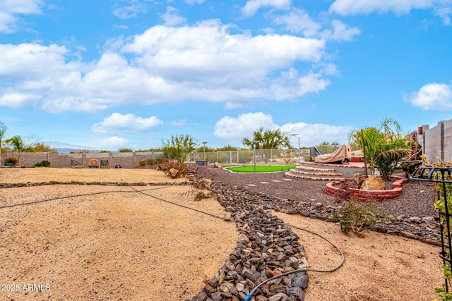 view of yard featuring fence