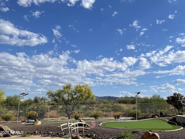 view of community featuring fence