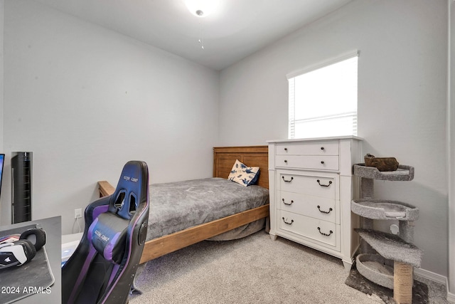 bedroom with light colored carpet