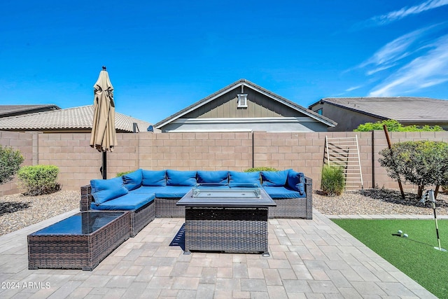 view of patio featuring an outdoor hangout area and a fenced backyard