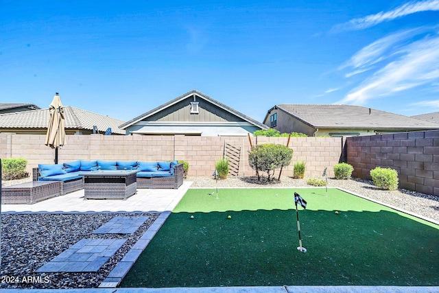 view of yard featuring a fenced backyard, an outdoor hangout area, and a patio