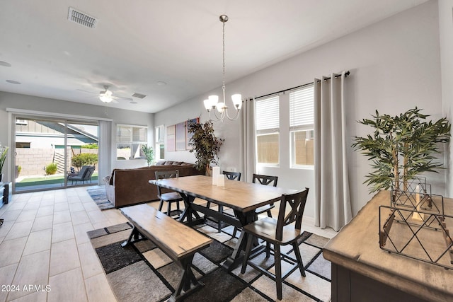 dining area with visible vents, plenty of natural light, and ceiling fan with notable chandelier