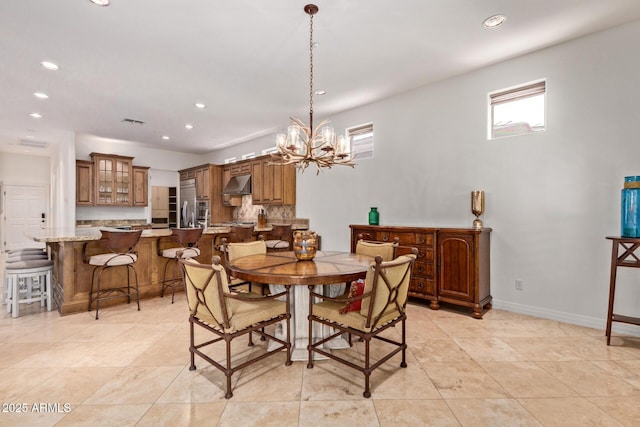8689 E Krail St, Scottsdale, AZ 85250 - dining area featuring a chandelier, recessed lighting, and light tile patterned floors