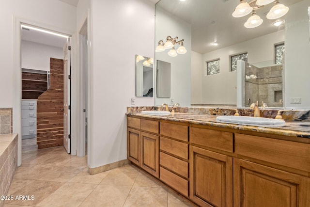 8689 E Krail St, Scottsdale, AZ 85250 - bathroom with double vanity, tile patterned flooring, and a tile shower