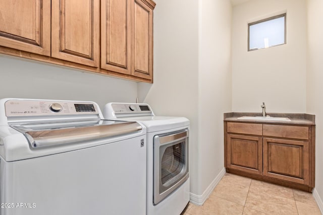 8689 E Krail St, Scottsdale, AZ 85250 - laundry room featuring washing machine and dryer, cabinet space, and light tile patterned floors