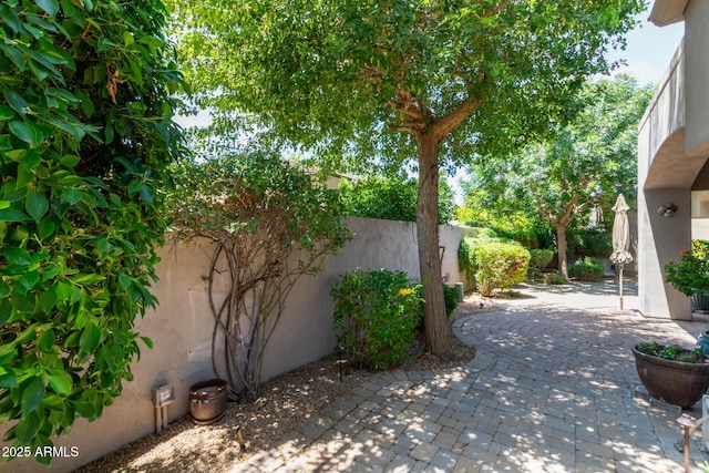 8689 E Krail St, Scottsdale, AZ 85250 - view of side of property featuring a patio, a fenced backyard, and stucco siding