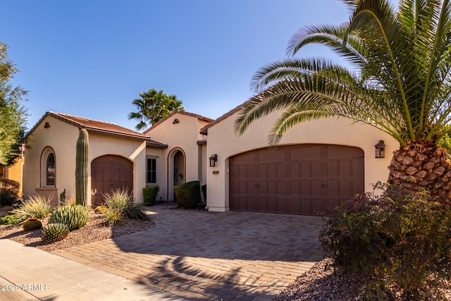 mediterranean / spanish-style house featuring a garage