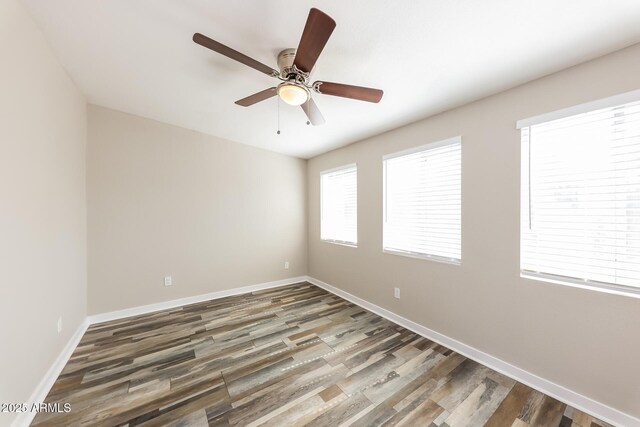 4833 N 63rd Ln, Phoenix, AZ 85033 - unfurnished room featuring a ceiling fan and wood finished floors