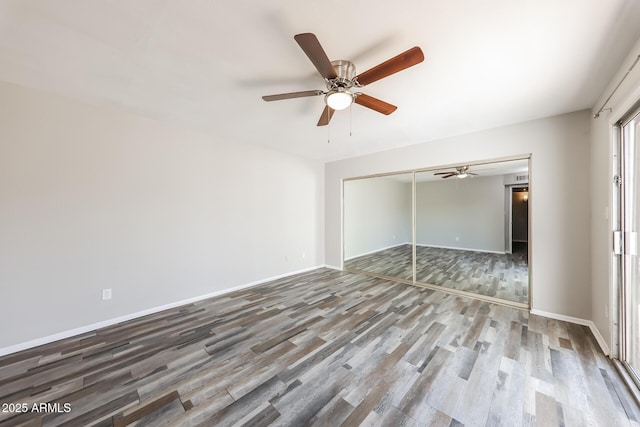 4833 N 63rd Ln, Phoenix, AZ 85033 - unfurnished bedroom with wood finished floors, a closet, and a ceiling fan