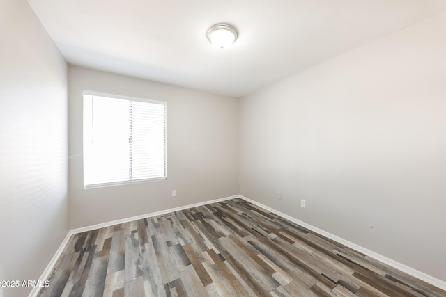 4833 N 63rd Ln, Phoenix, AZ 85033 - spare room featuring wood finished floors