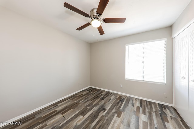 4833 N 63rd Ln, Phoenix, AZ 85033 - unfurnished room featuring dark wood-type flooring and a ceiling fan