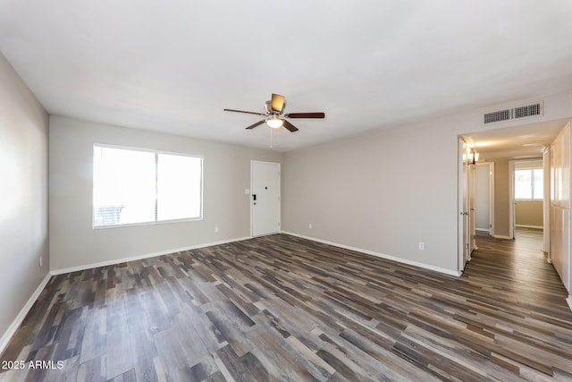 4833 N 63rd Ln, Phoenix, AZ 85033 - empty room with dark wood finished floors and a ceiling fan