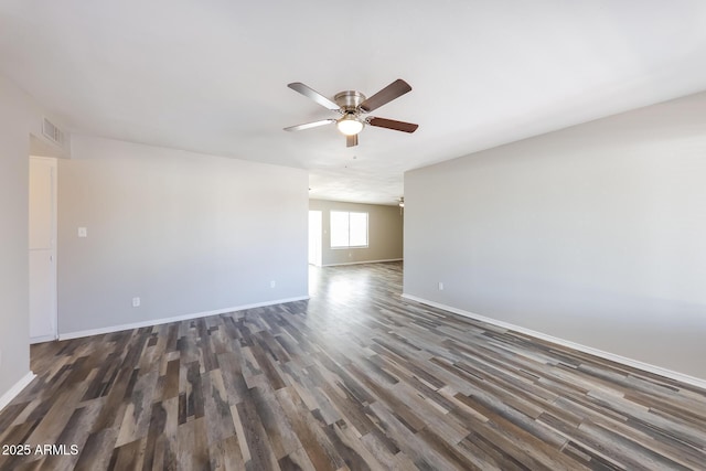 4833 N 63rd Ln, Phoenix, AZ 85033 - spare room with ceiling fan and dark wood-style flooring
