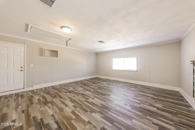 4833 N 63rd Ln, Phoenix, AZ 85033 - spare room featuring attic access, wood finished floors, and crown molding