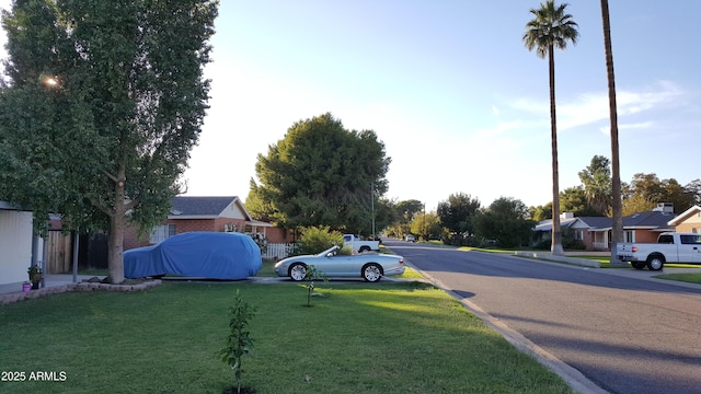 4139 E Edgemont Ave, Phoenix, AZ 85008 - view of asphalt road with a residential view and curbs