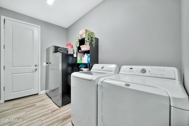 washroom with washing machine and dryer