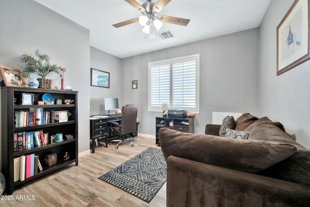 office with ceiling fan and light wood-type flooring