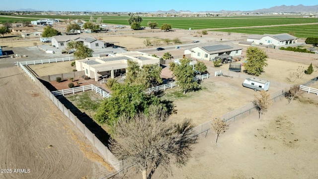 birds eye view of property with a mountain view and a rural view