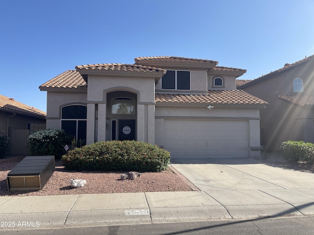 4633 E Desert Cactus St, Phoenix, AZ 85032 - mediterranean / spanish-style house featuring stucco siding, a tile roof, driveway, and an attached garage
