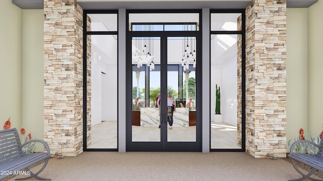 doorway with carpet flooring, a high ceiling, and french doors