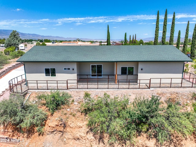 back of property with a mountain view