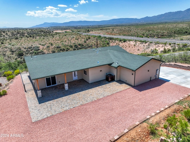 drone / aerial view featuring a mountain view