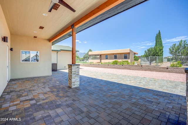 view of patio featuring ceiling fan