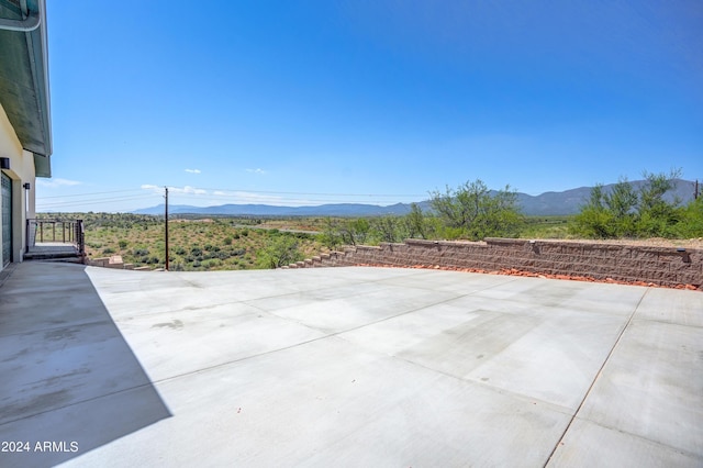 view of patio with a mountain view