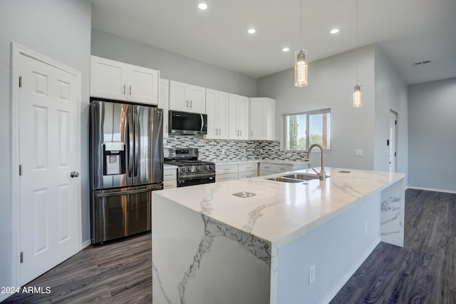 kitchen featuring white cabinetry, appliances with stainless steel finishes, sink, and pendant lighting