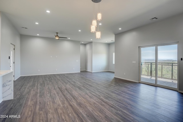 unfurnished room featuring ceiling fan and dark hardwood / wood-style floors