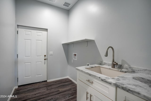 clothes washing area featuring hookup for a washing machine, sink, and dark hardwood / wood-style floors