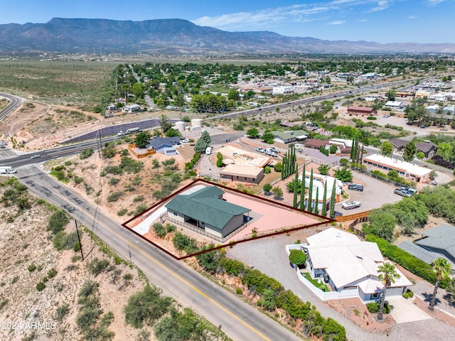 birds eye view of property featuring a mountain view