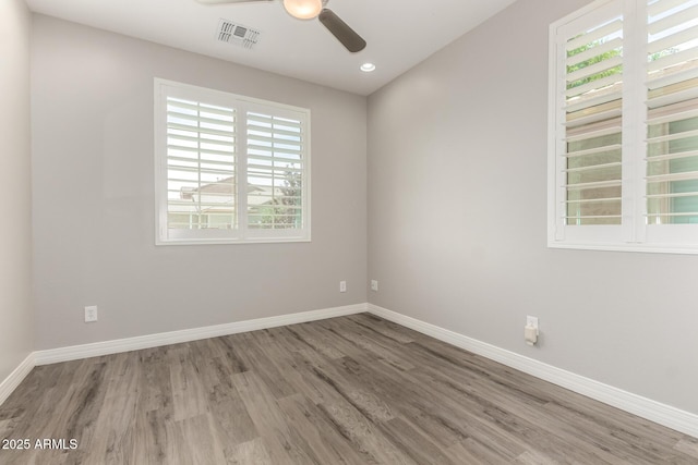5407 S Tatum Ln, Gilbert, AZ 85298 - empty room with a ceiling fan, wood finished floors, baseboards, and recessed lighting