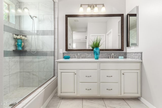 5407 S Tatum Ln, Gilbert, AZ 85298 - full bathroom with marble finish floors, tiled shower, double vanity, and baseboards