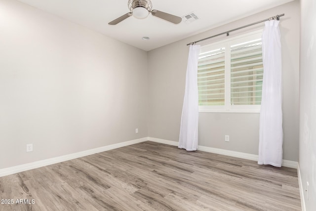 5407 S Tatum Ln, Gilbert, AZ 85298 - empty room with wood finished floors, baseboards, and a ceiling fan