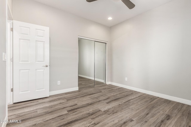 5407 S Tatum Ln, Gilbert, AZ 85298 - unfurnished bedroom with a closet, wood finished floors, baseboards, and recessed lighting