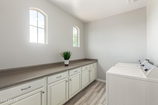 5407 S Tatum Ln, Gilbert, AZ 85298 - laundry room featuring washer and clothes dryer, cabinet space, baseboards, and light wood finished floors