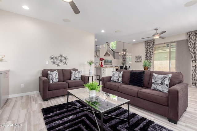 5407 S Tatum Ln, Gilbert, AZ 85298 - living room featuring ceiling fan, a chandelier, light wood-style floors, baseboards, and recessed lighting