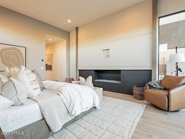 bedroom with hardwood / wood-style flooring