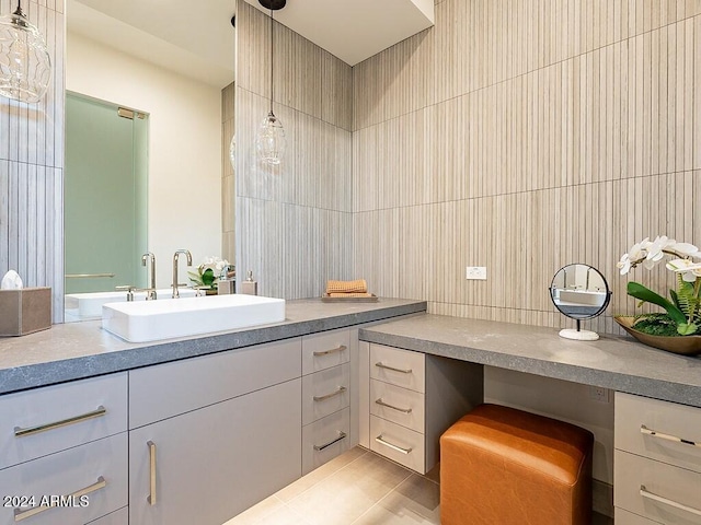 bathroom featuring tile walls and vanity