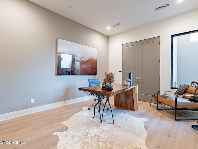 home office featuring light hardwood / wood-style flooring