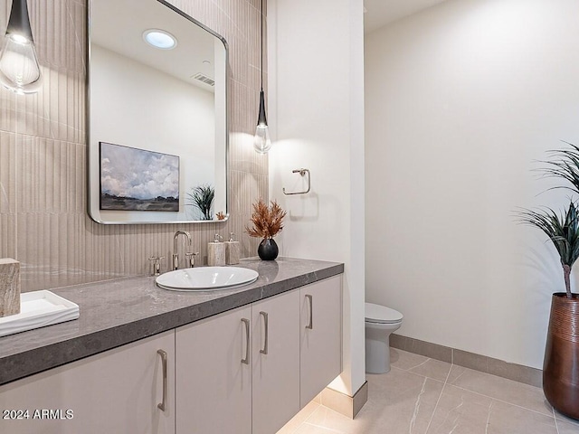 bathroom featuring toilet and vanity