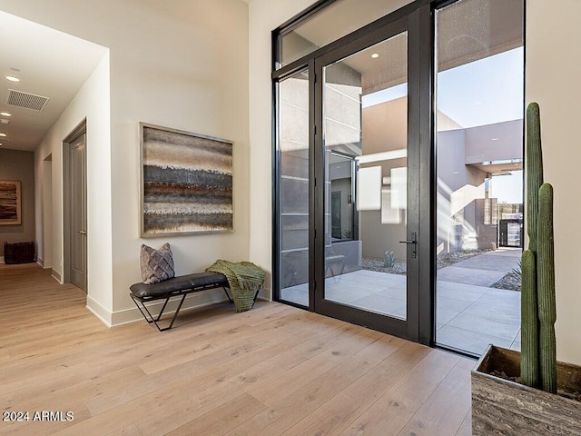 doorway to outside featuring light wood-type flooring