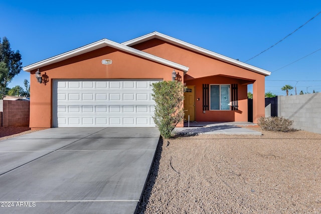 ranch-style house featuring a garage