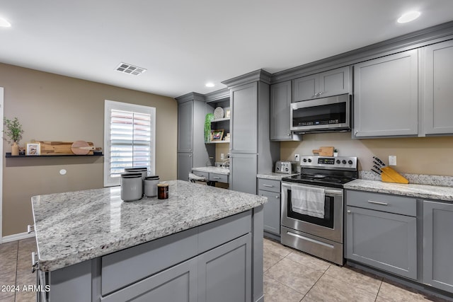 kitchen featuring gray cabinetry and stainless steel appliances