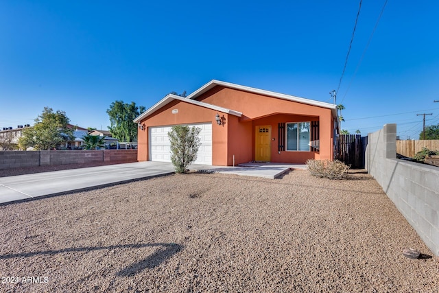 single story home featuring a garage