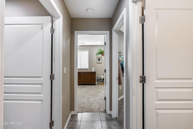 hallway featuring light tile patterned flooring