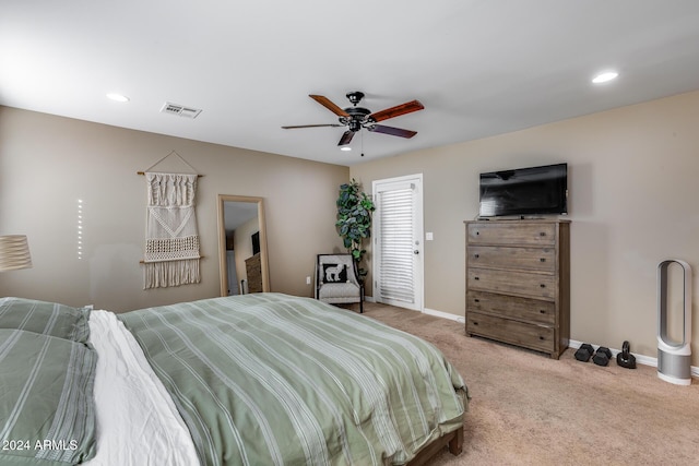 bedroom featuring light carpet and ceiling fan