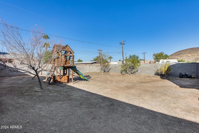 view of yard with a playground